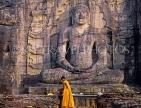SRI LANKA, Polonnaruwa, Gal Viahre (stone temple), granite carved seated Buddha, and monk, SLK1948JPL