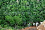 SRI LANKA, Sigiriya Rock Fortress, visitors climbing down from rock, SLK2192JPL