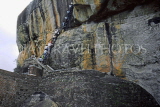 SRI LANKA, Sigiriya Rock Fortress, visitors climbing up rock face, SLK2193JPL