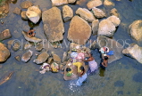SRI LANKA, rural scene, Kandy area, people washing clothes in river, SLK1505JPL