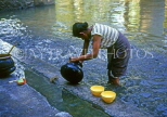 SRI LANKA, rural scene, village woman washing pot by river, SLK2105JPL