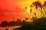 SRI LANKA, south coast, Ahangama area, sunset with coconut trees in silhouette, SLK4752JPL