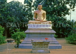 SRI LANKA, south coast, Moratuwa, Buddha statue at roadside shrine, SLK2146JPL