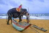 SRI LANKA, south coast, beach, and child on elephant ride, SLK183JPL