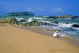 SRI LANKA, south coast, child playing on beach, SLK1660JPL