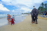 SRI LANKA, west coast, beach with tourists and boy on elephant ride, SLK2021JPL