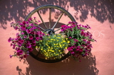 SWITZERLAND, Valais, Alps, Le Tretien, cart wheel with flower box,, on house wall, SW1422JPL