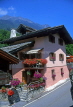 SWITZERLAND, Valais, LE TRETIEN, village street and chalet with flowers, SW1415JPL