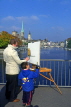 SWITZERLAND, Zurich, artist painting on Quai Bridge, SW386JPL