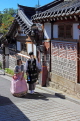 South Korea, SEOUL, Bukchon Hanok Village, couple in Hanbok attire, visiting, SK966JPL