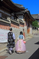 South Korea, SEOUL, Bukchon Hanok Village, couple in Hanbok attire, visiting, SK967JPL