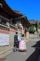 South Korea, SEOUL, Bukchon Hanok Village, couple in Hanbok attire, visiting, SK969JPL