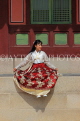 South Korea, SEOUL, Changdeokgung Palace, visitor in Hanbok attire posing for photo, SK250PL
