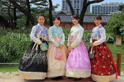 South Korea, SEOUL, Changdeokgung Palace, visitors in Hanbok attire posing for photo, SK224JPL