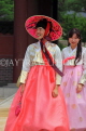 South Korea, SEOUL, Changdeokgung Palace, visitors in colourful Hanbok attire, SK235PL