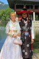 South Korea, SEOUL, Gyeongbokgung Palace, couple in Hanbok attire posing for photo, SK368JPL