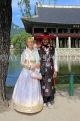 South Korea, SEOUL, Gyeongbokgung Palace, couple in Hanbok attire posing for photo, SK369JPL