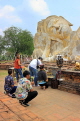 THAILAND, Ayutthaya, Wat Lokaya Sutha, reclining Buddha, and worshippers), THA2712JPL