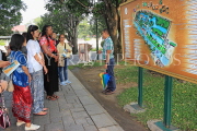 THAILAND, Bang Pa-In (nr Ayutthaya), tour guide and visitors at site, THA2619JPL