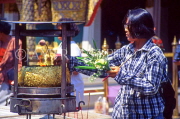 THAILAND, Bangkok, GRAND PALACE (Wat Phra Keo), worshipper with flower offerings, THA992JPL