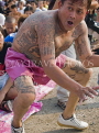 THAILAND, Bangkok, Wat Bang Phra, tattooed man acting in trance at tattoo festival, THA2199JPL