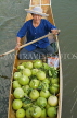 THAILAND, Damnoen Saduak (Floating Market), vendor rowing boat with pomelos, THA2182JPL