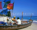 THAILAND, Hua-Hin, beach scene with fishermen sorting out nets on boat, THA1754JPL