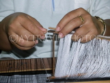 THAILAND, Korat, worker's hands weaving silk on loom, THA2098JPL