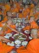 THAILAND, Northern Thailand, Mae Hong Son, novice monks feasting, THA2130PL