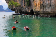 THAILAND, Phang Nga Bay, Panak Island, tourists exploring by sea canoe, THA4258JPL