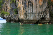THAILAND, Phang Nga Bay, Panak Island, tourists exploring by sea canoe, THA4272JPL