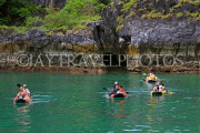 THAILAND, Phang Nga Bay, Panak Island, tourists exploring caves by sea canoe, THA4270JPL