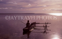 TONGA, Atata Island, Tongan boy in catamaran, dusk, TON104JPLA