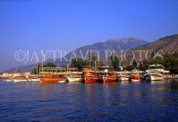 TURKEY, Fethiye, coastal view, and boats lined up, TUR586JPL