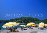 TURKEY, Fethiye area, Olu Deniz, beach with sunbathers and parasols, TUR292JPL
