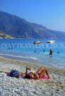TURKEY, Fethiye coast, sunbather on beach, TUR689JPL