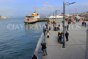 TURKEY, Istanbul, Eminonu Waterfront, ferry and people fishing, TUR961JPL