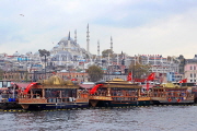 TURKEY, Istanbul, Eminonu Waterfront, floating cafes, Blue Mosque in background, TUR1011JPL
