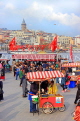 TURKEY, Istanbul, Eminonu Waterfront, food stalls, and New City in background, TUR971JPL