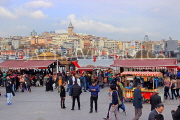 TURKEY, Istanbul, Eminonu Waterfront, food stalls and crowds, New City in background, TUR966JPL