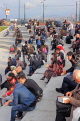 TURKEY, Istanbul, Eminonu Waterfront, people relaxing and chatting, TUR973JPL