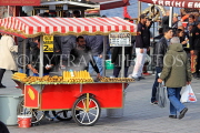TURKEY, Istanbul, Eminonu Waterfront, street food, corn and chestnut stall, TUR976JPL