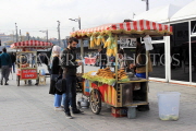 TURKEY, Istanbul, Eminonu Waterfront, street food, corn and chestnut stalls, TUR983JPL
