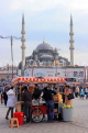 TURKEY, Istanbul, Eminonu Waterfront, street food stall, Yeni Mosque in background, TUR981JPL