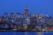 TURKEY, Istanbul, Eminonu Waterfront, view of New City & Galata Tower, night, TUR1412JPL