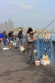 TURKEY, Istanbul, Galata Bridge, people fishing, TUR995PL