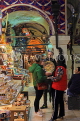 TURKEY, Istanbul, Grand Bazaar (Kapali Carsi), customers bargaining with vendor, TUR1291JPL