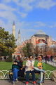 TURKEY, Istanbul, Hagia Sophia (Ayasofya mosque), people on park bench, TUR919JPL