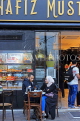 TURKEY, Istanbul, coffee and cake shop, couple seated outside, TUR988JPL