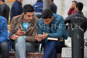 TURKEY, Istanbul, two men checking out their phones, TUR1400JPL